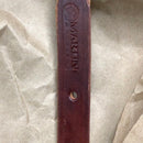 End of Martin Saddlery latigo leather breast collar tug showing stamped logo.