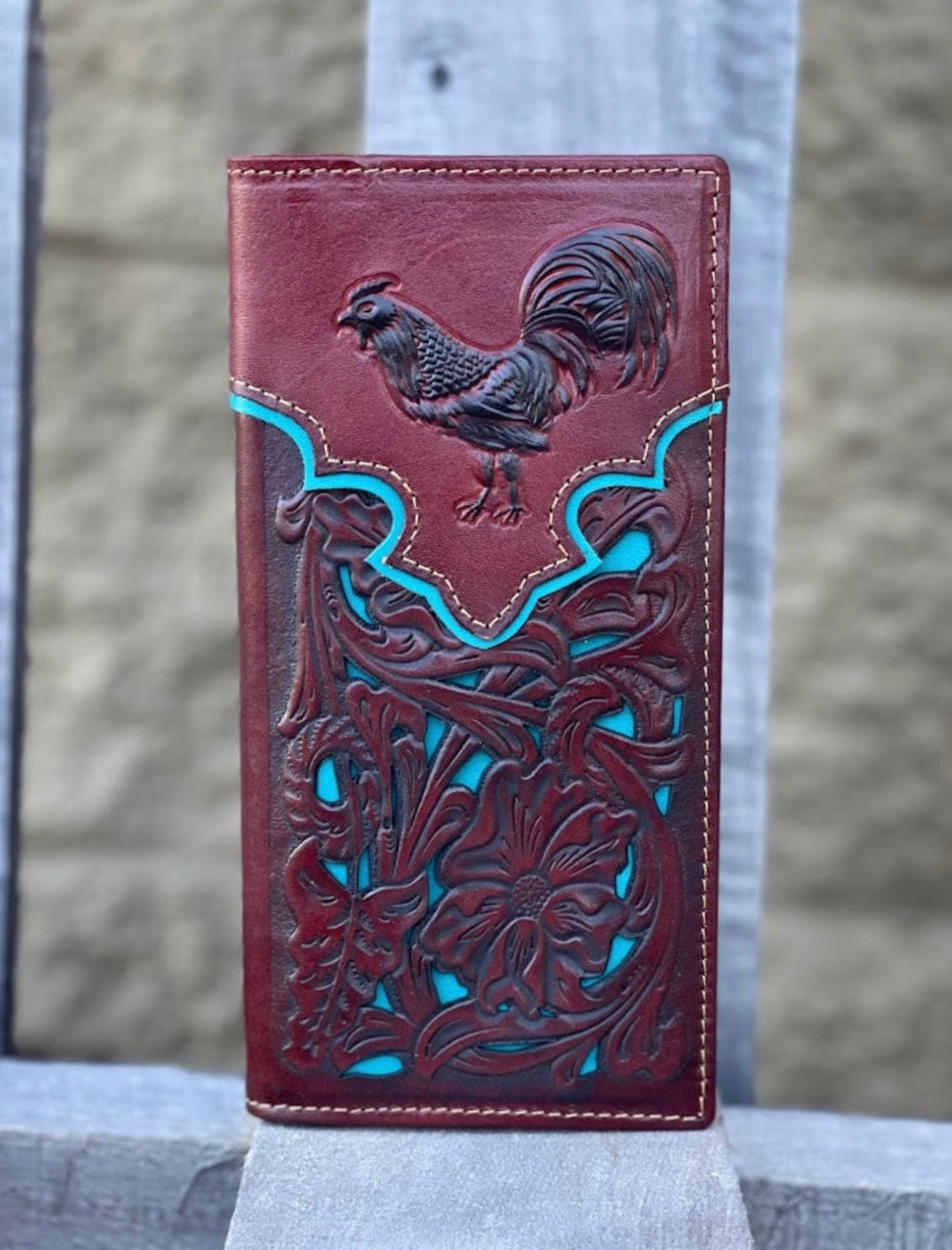 Brown leather tall wallet with a embossed Rooster design and turquoise blue inlay. Front View