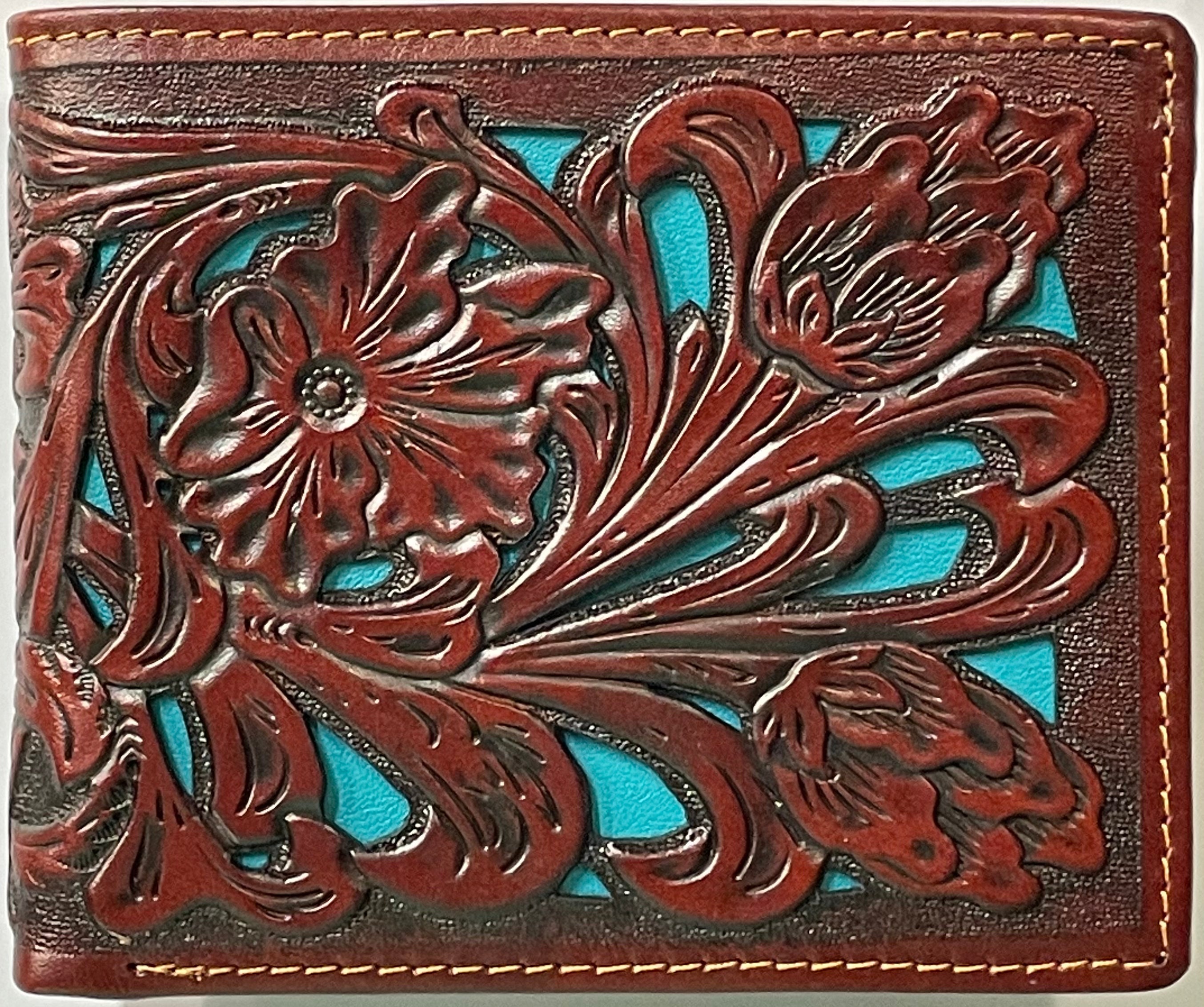 This Brown tooled leather bifold wallet has a Turquoise inlay. 