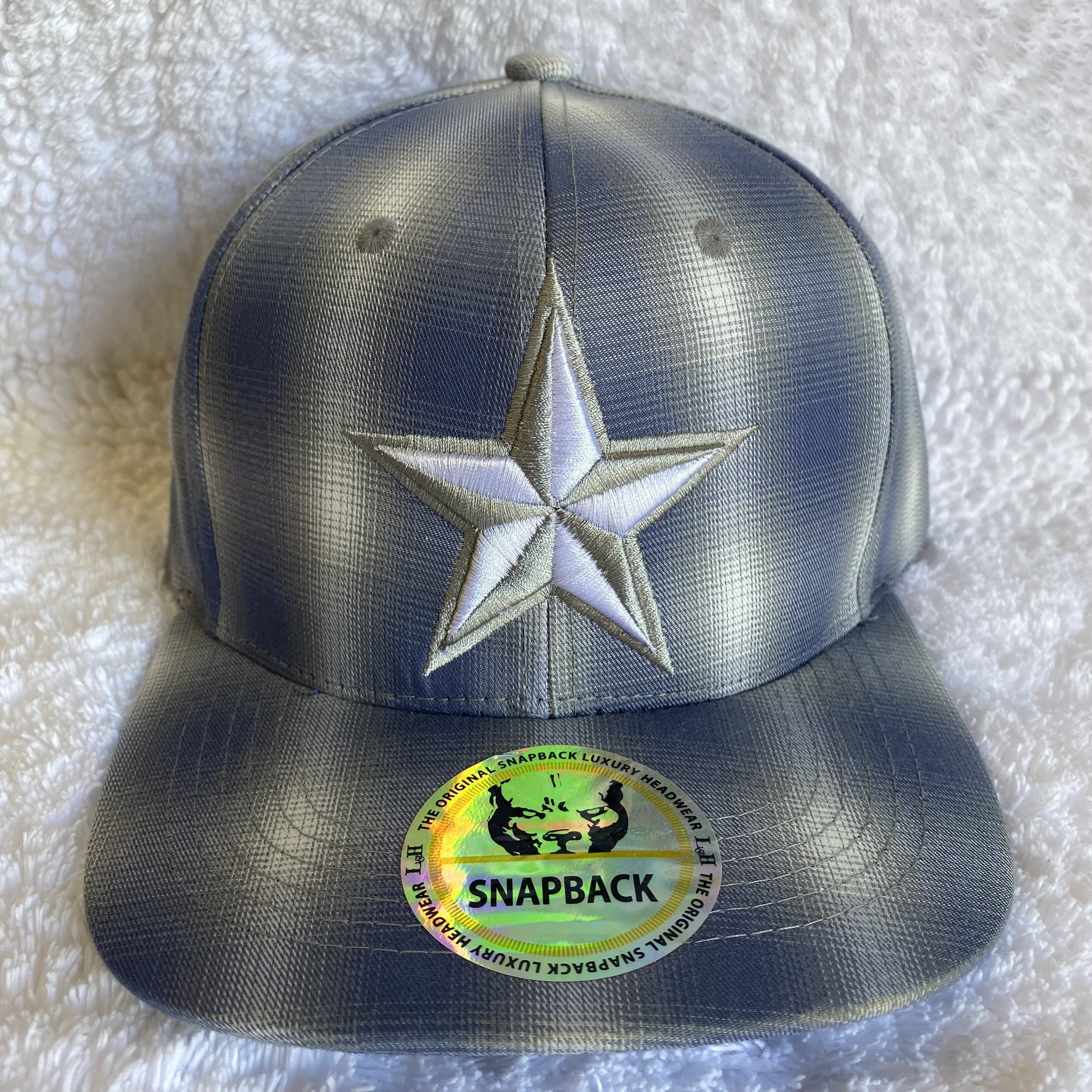 Blue plaid snapback cap with a embroidered star. Front View  