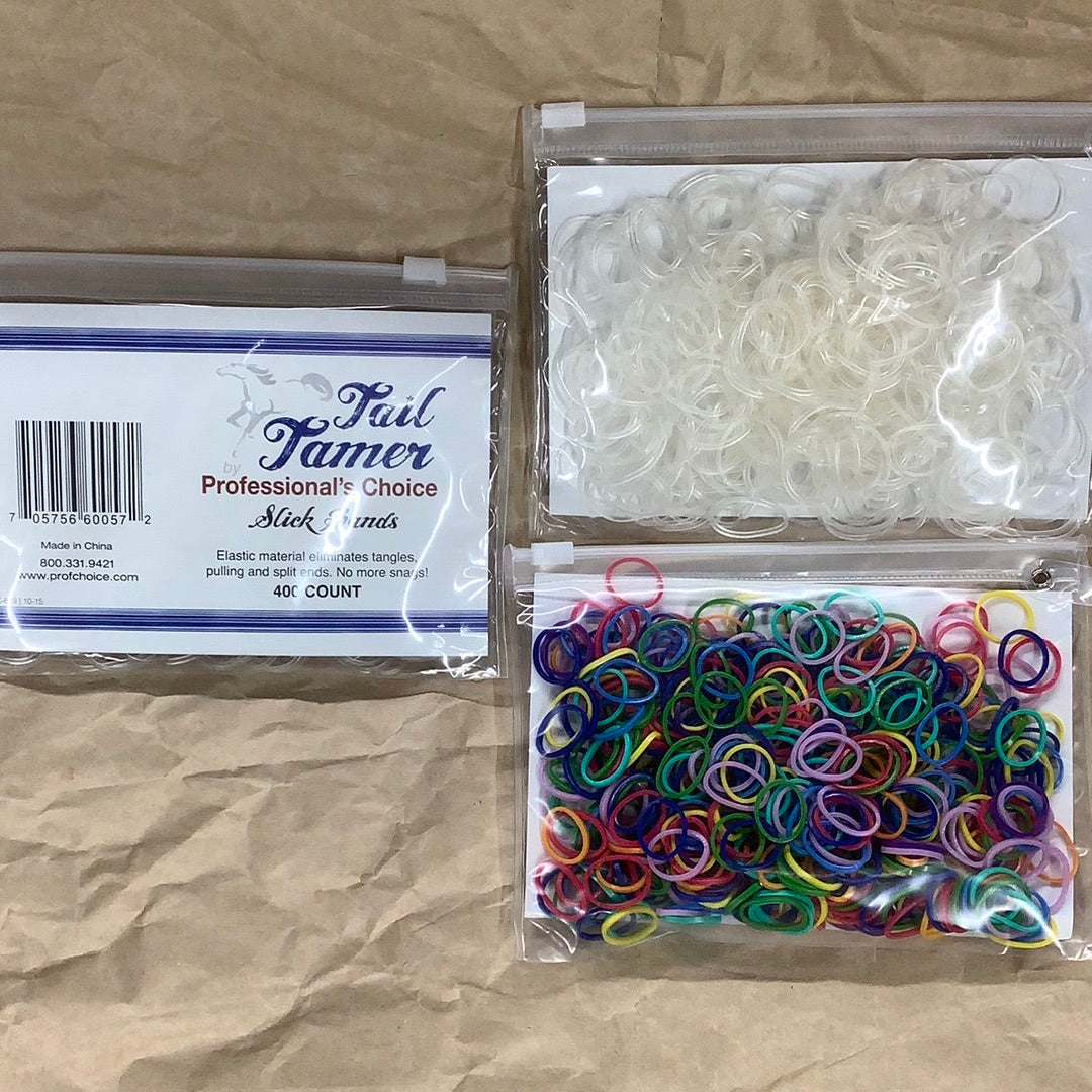 Packages of Tail Tamer Slick Bands in clear or multi-color.