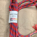 Coiled red and blue jerk line for calf roping.