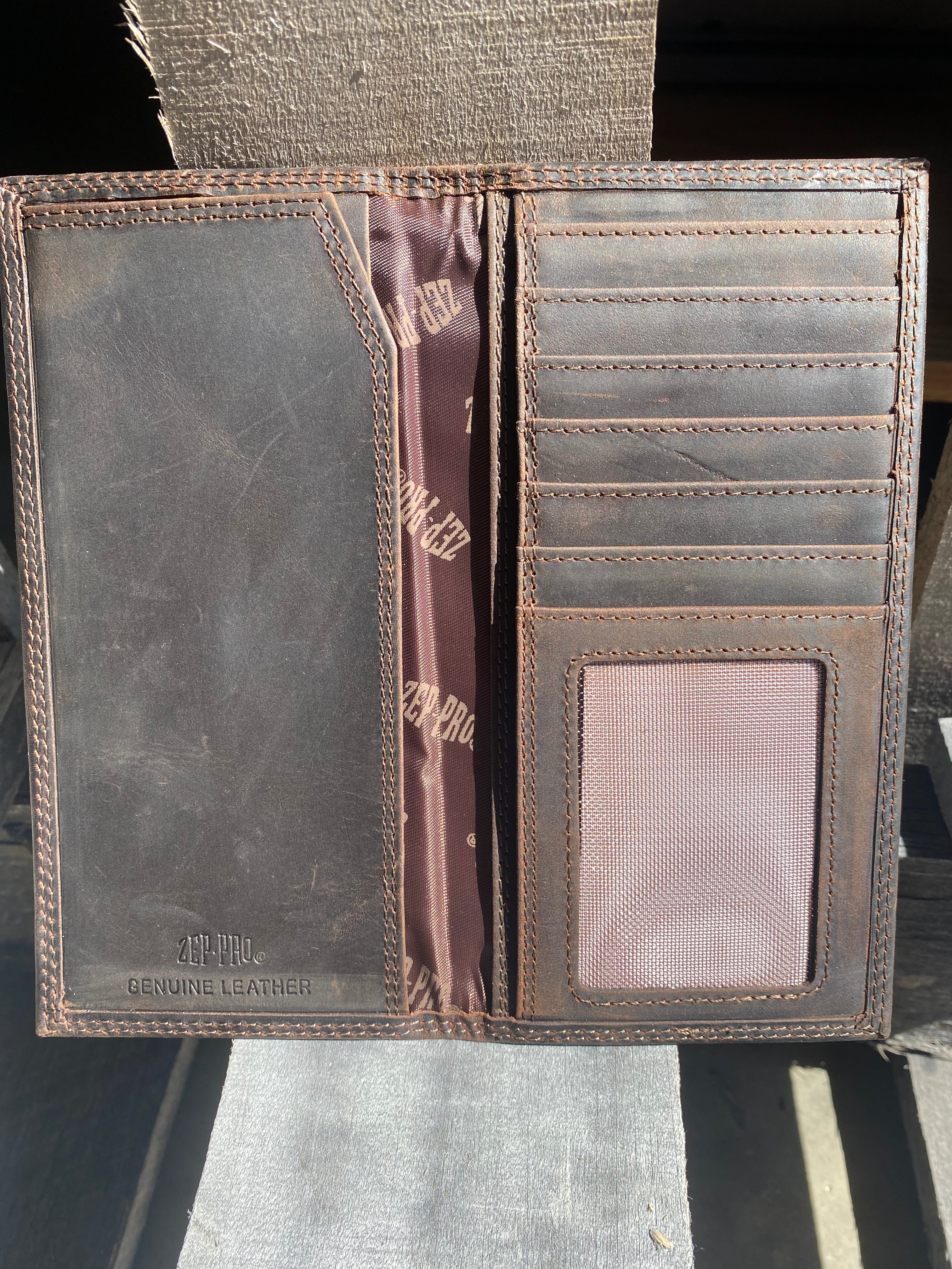 Zep-Pro LSU Tigers 1/2 Mossy Oak Camo Leather Tall Wallet inside view showing:
Brown distressed leather
6 interior credit card slots
1 ID window
2 bill/cash compartments