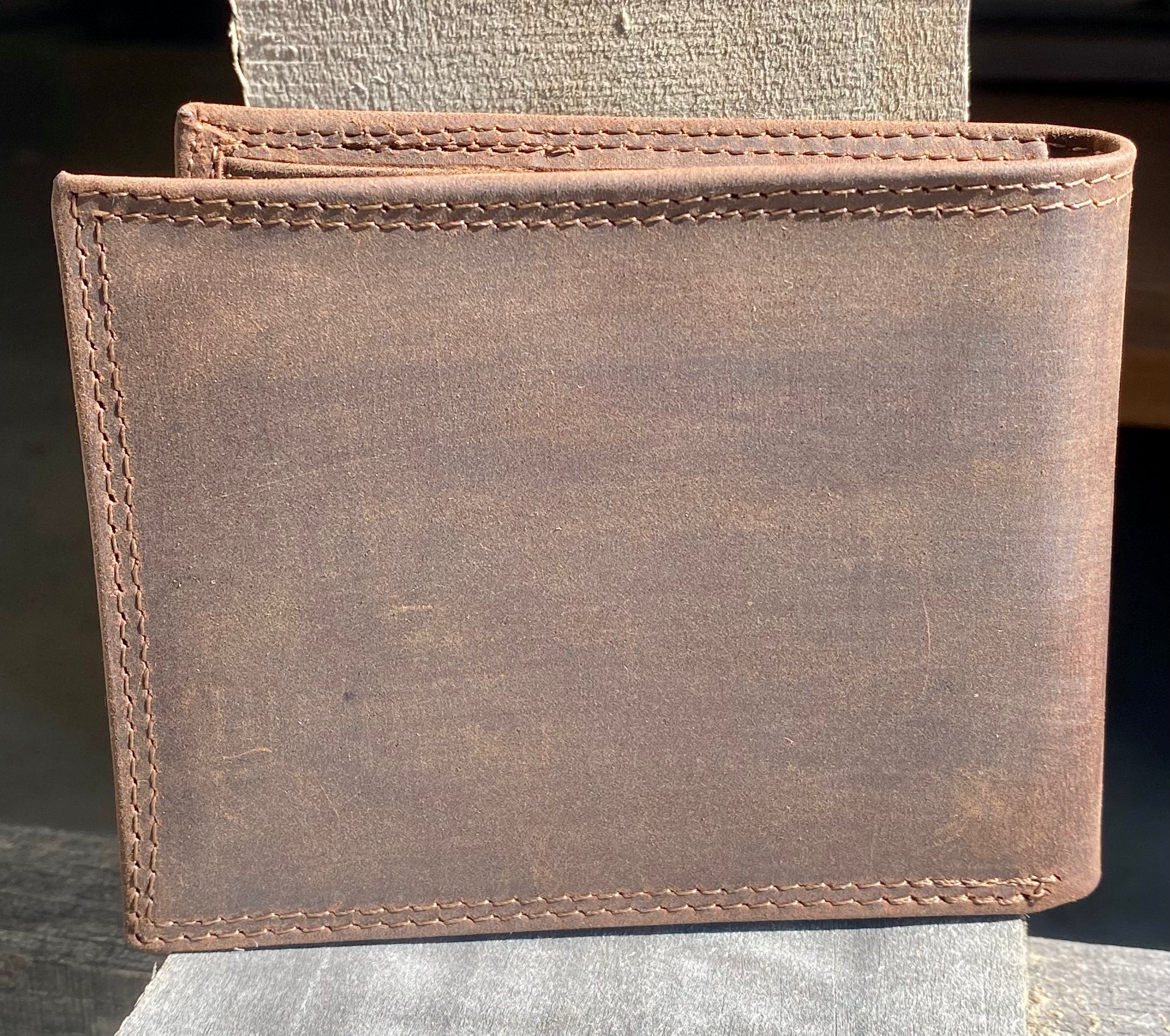 Zep-Pro Auburn University Brown “Crazy Horse” Leather Bifold Wallet. back view of brown distressed leather.