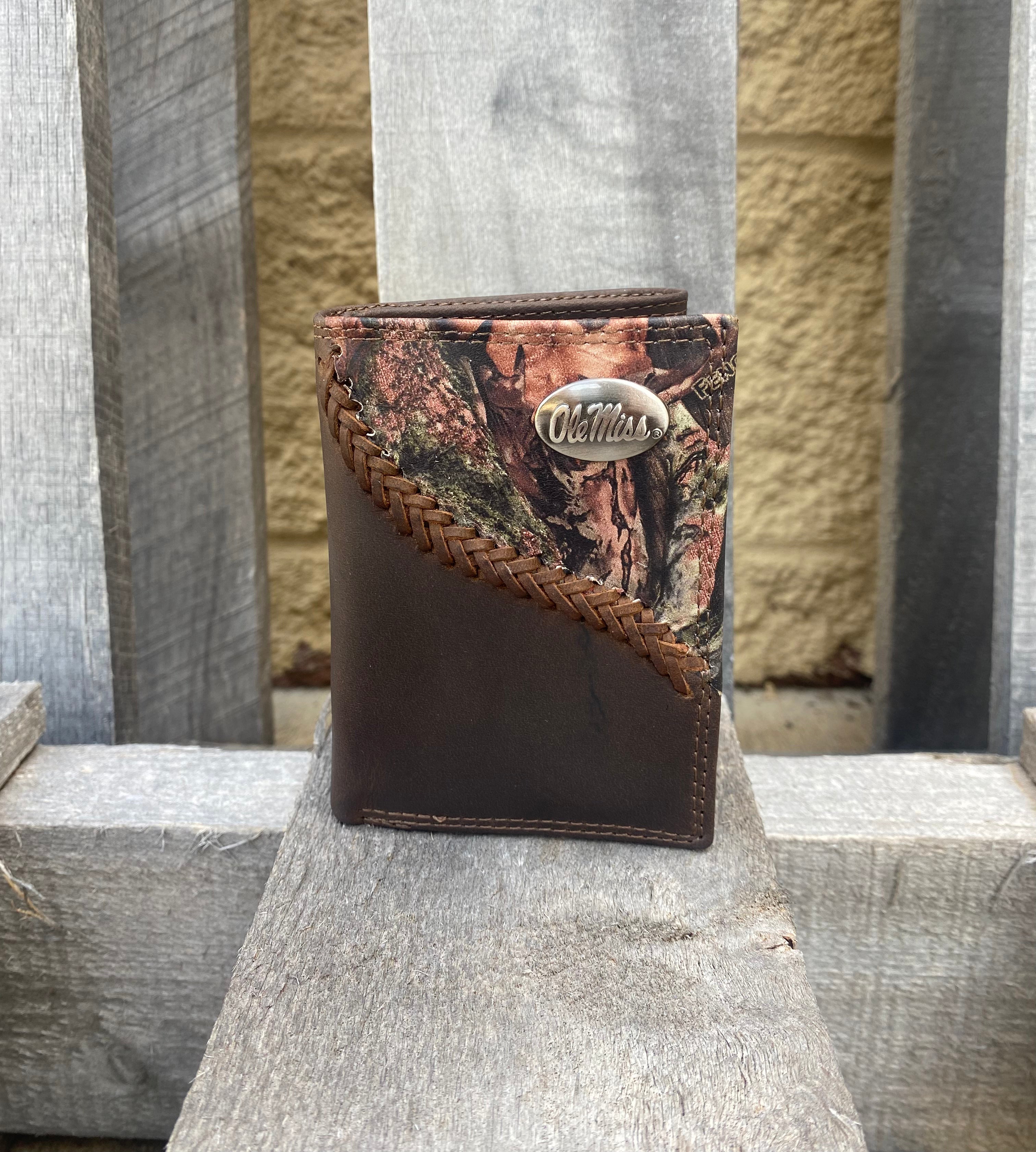 Zep-Pro University of Mississippi 1/2 Mossy Oak Camo/Brown leather Tri-fold Wallet with a brass Ole Miss concho on top right corner of camo leather. Front view