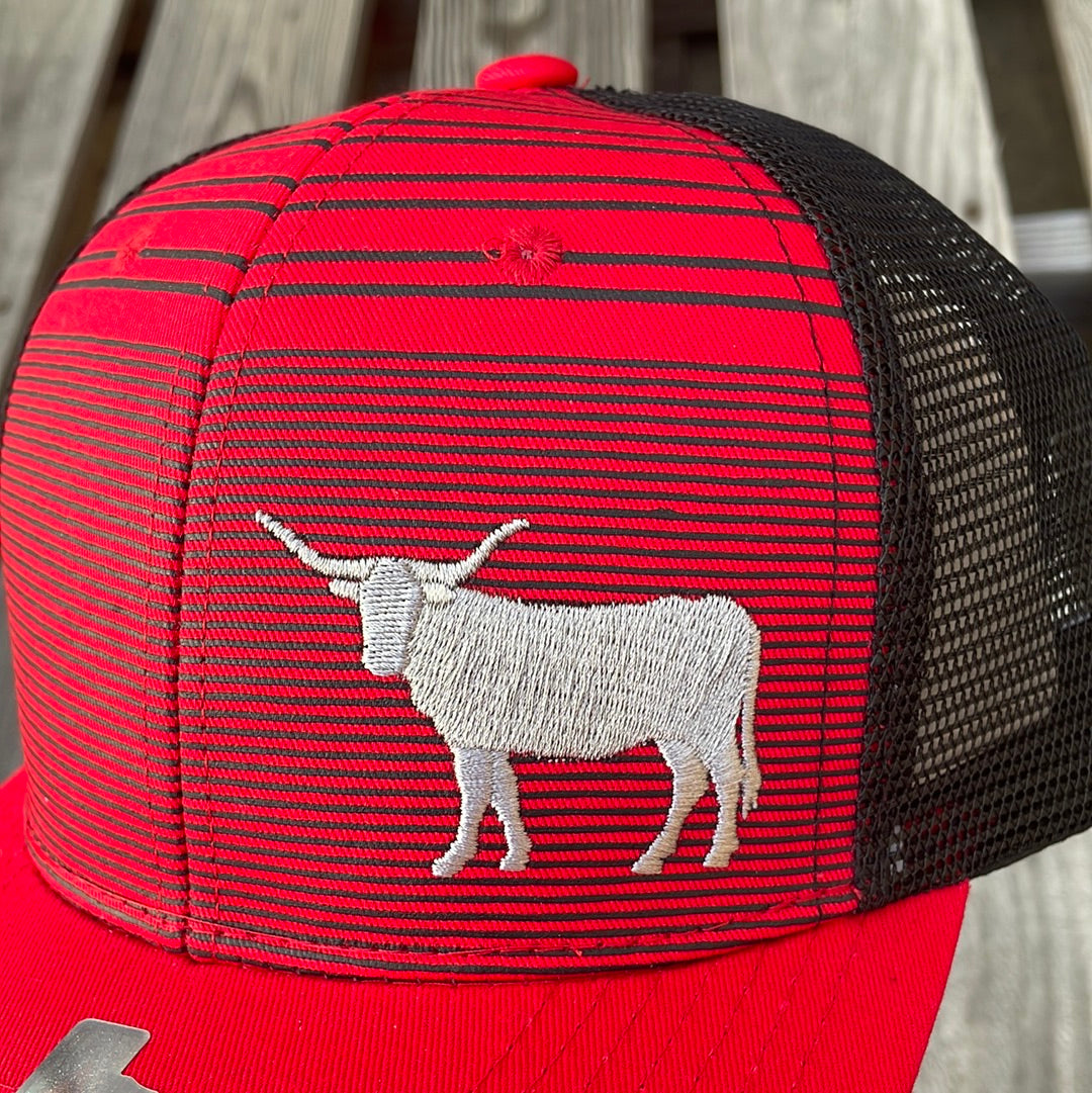 Red and Black trucker cap with a embroidered longhorn design. It has a solid Red brim and a Black mesh back. Close up view of longhorn design. 