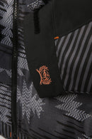 Women's Cinch ski jacket in Black and a Grey geometric print and Heather Red hood pull strings. Close up of cuff showing embroidered Cinch logo.  