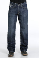 Men's White Label Dark Wash jeans front view showing detail of front pockets and zipper. Also shows relaxed  fit and stack on boots.