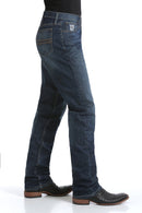 Side view of Cinch Silver Label Dark Stone wash jeans. Shows detail of right front coin and hip pockets, back pocket, and slim fit with straight leg on boots.
