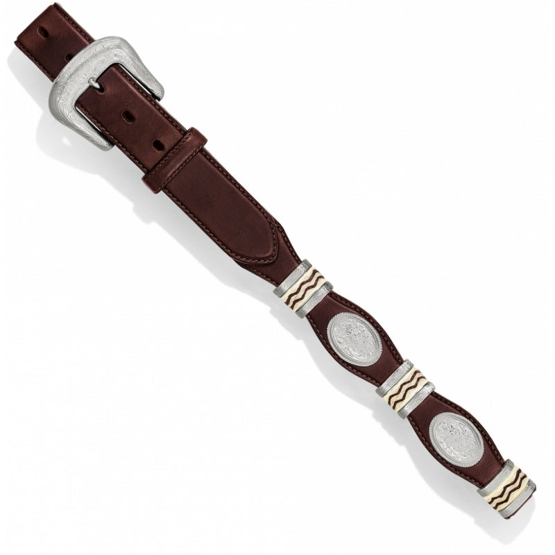 Brown Western style leather belt with concho detailing and a silver buckle. 