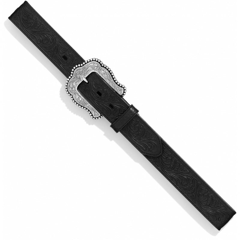 Women's Tony Lama black leather  Western Style belt with floral tooled design and a silver buckle featuring intricate western scroll work. Aerial view laid flat. 