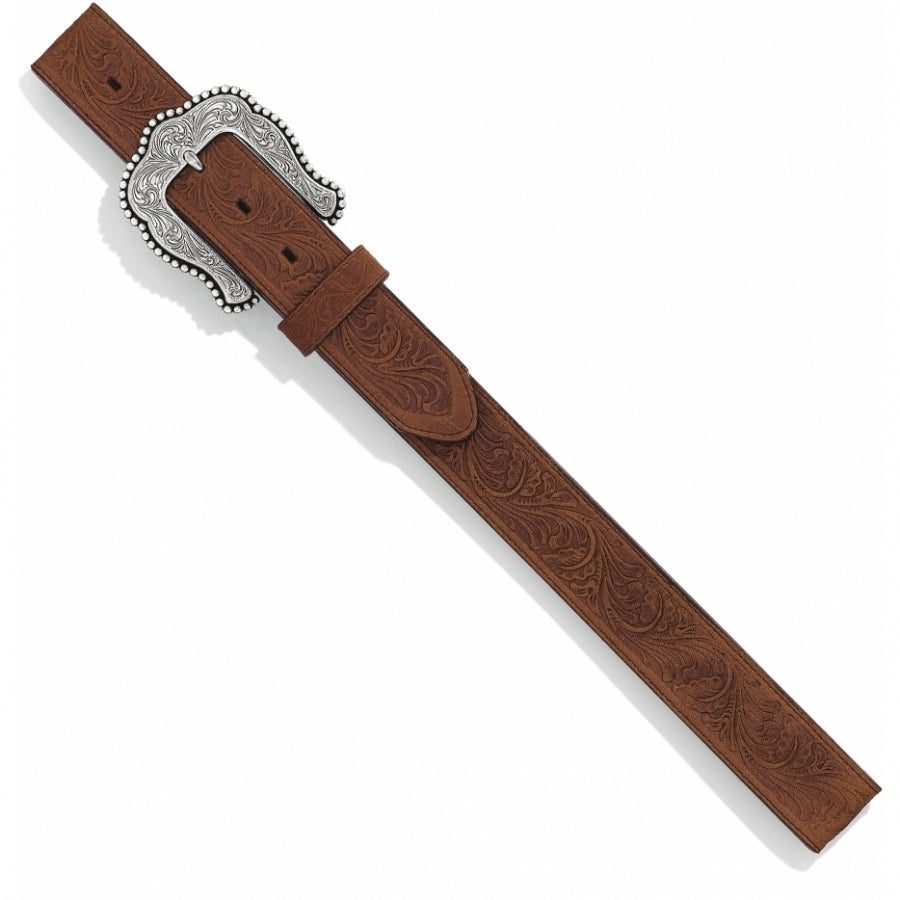 Ladies Western style brown leather belt with a floral tooled design and a silver buckle featuring intricate western scroll work. 